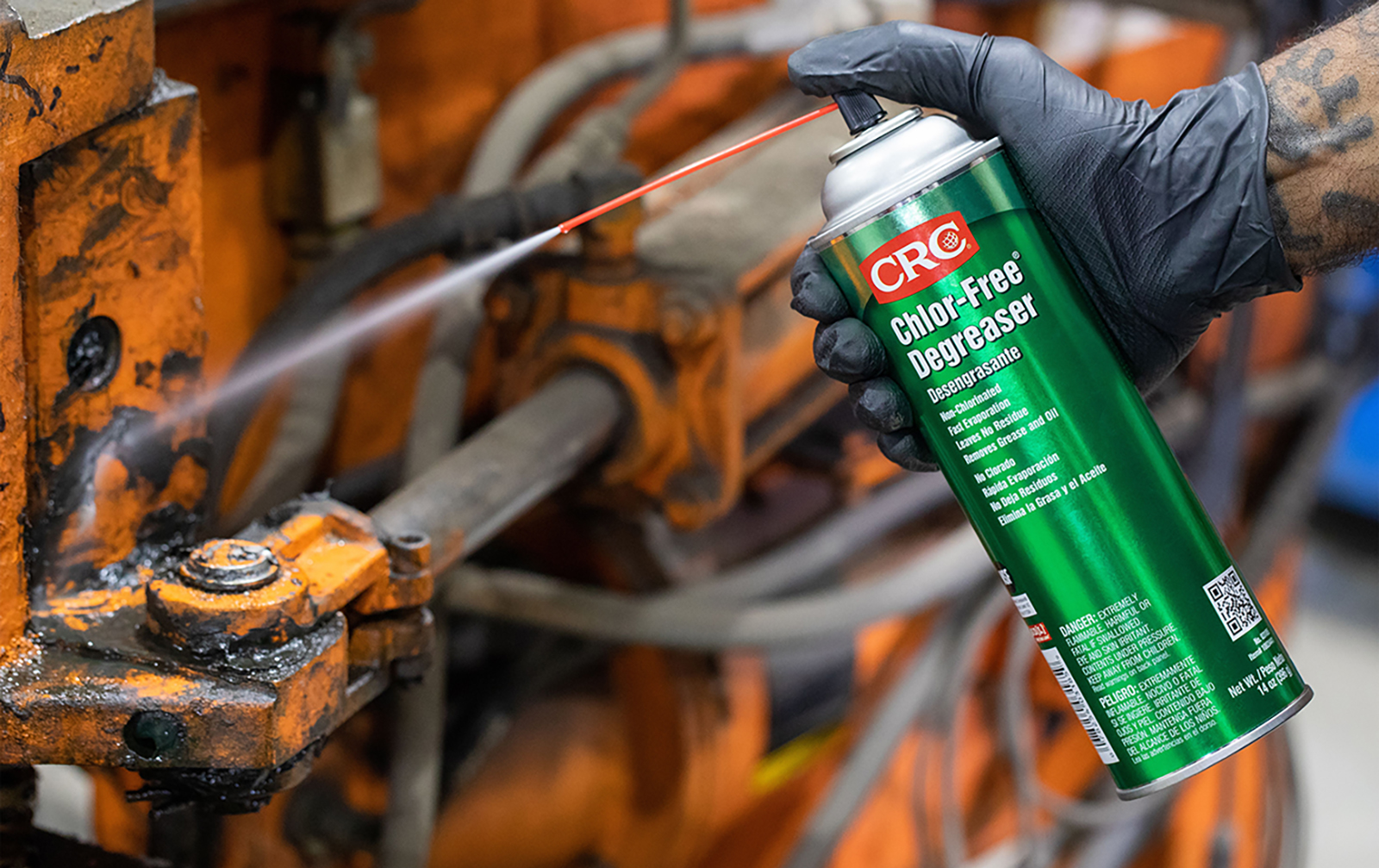can of degreaser spraying