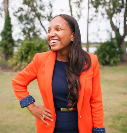 Woman with orange blazer