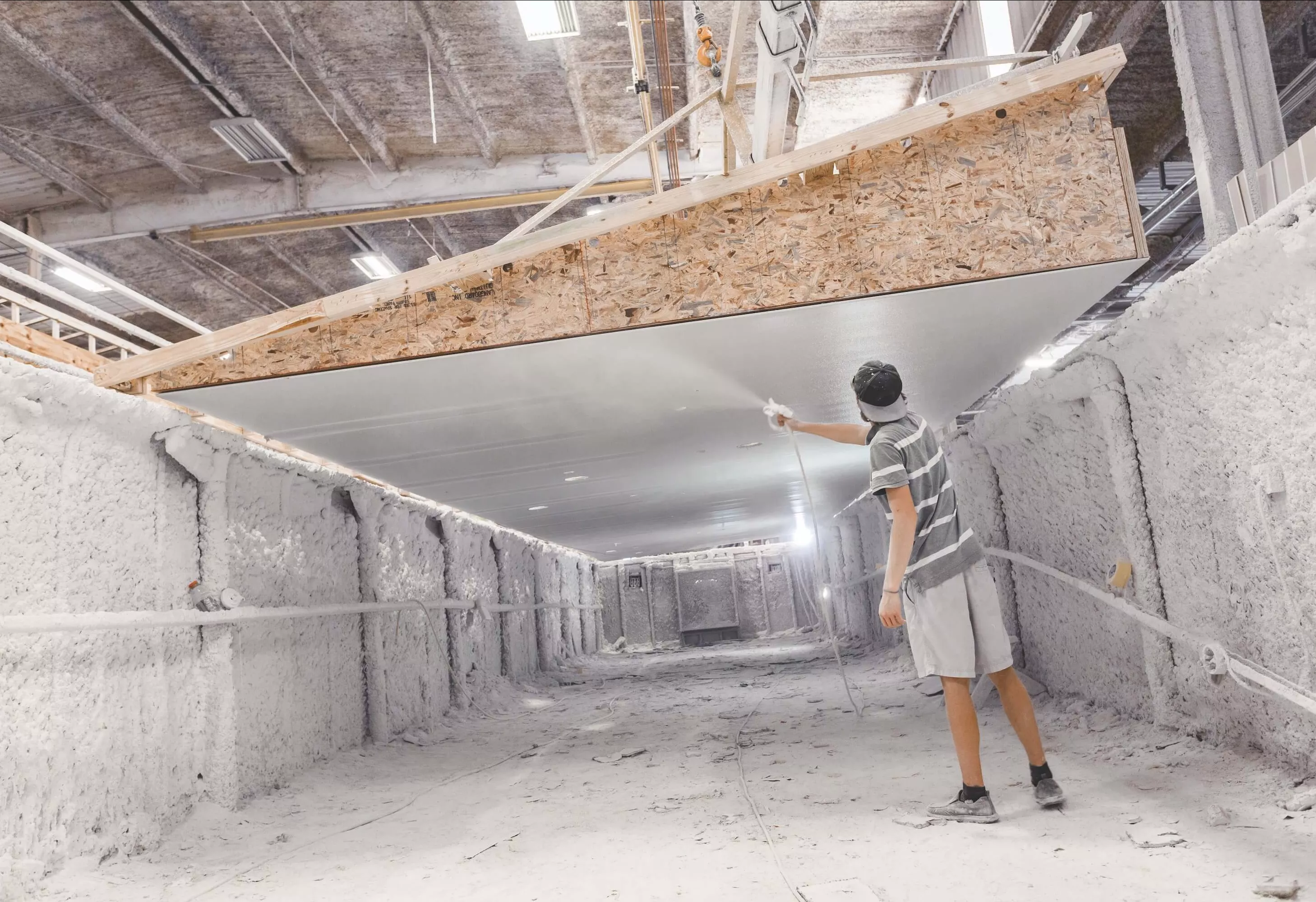 Man spraying vapor barrier