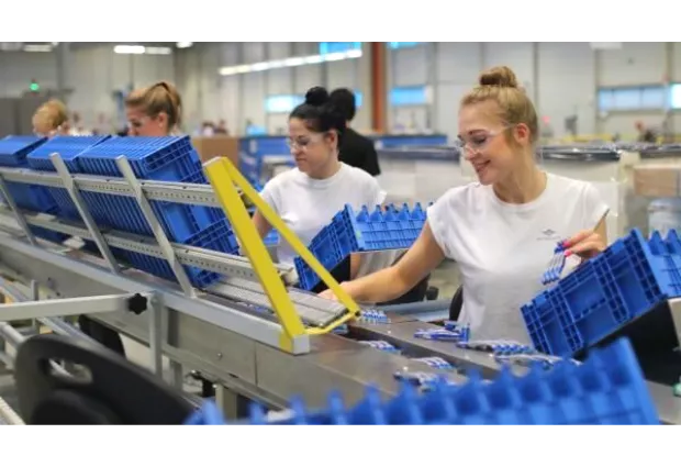 Women working in a manufacturing plant.