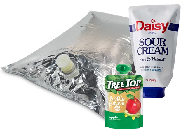 Various fitment pouches including inverted Daisy sour cream, stand up Tree Top applesauce, and aseptic food service package for bulk items