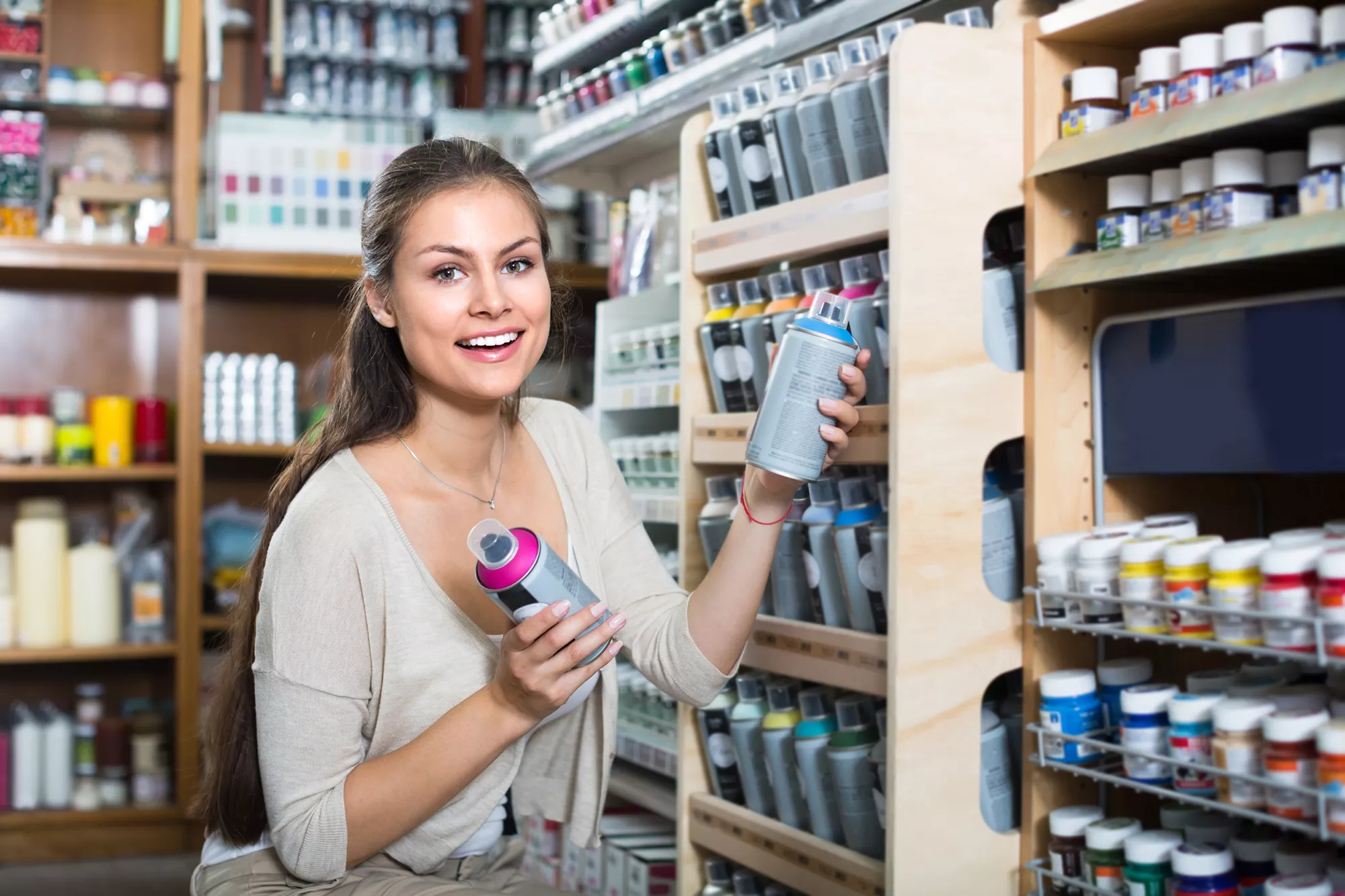 Image of female holding an aerosol product