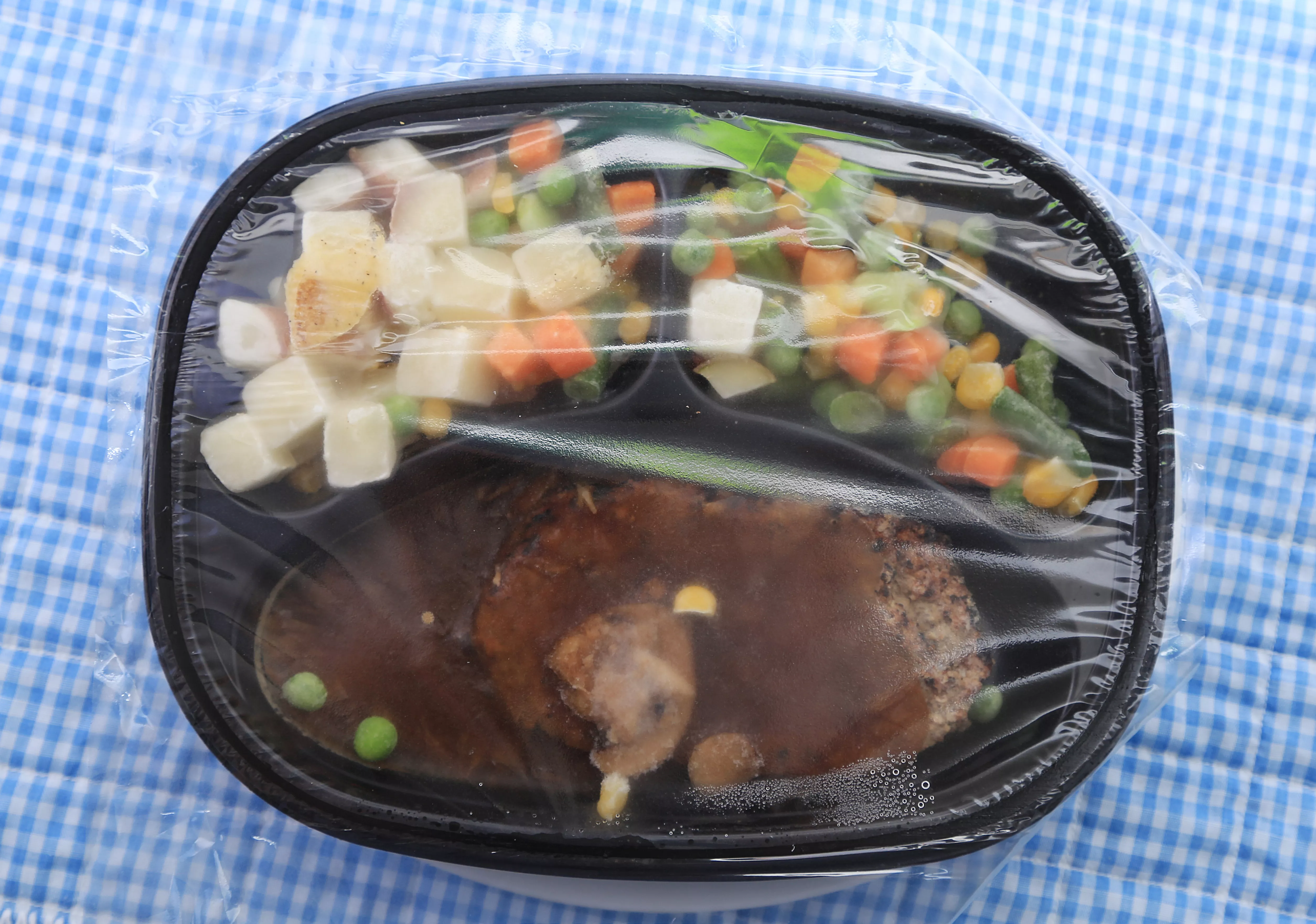 TV dinner with plastic film.