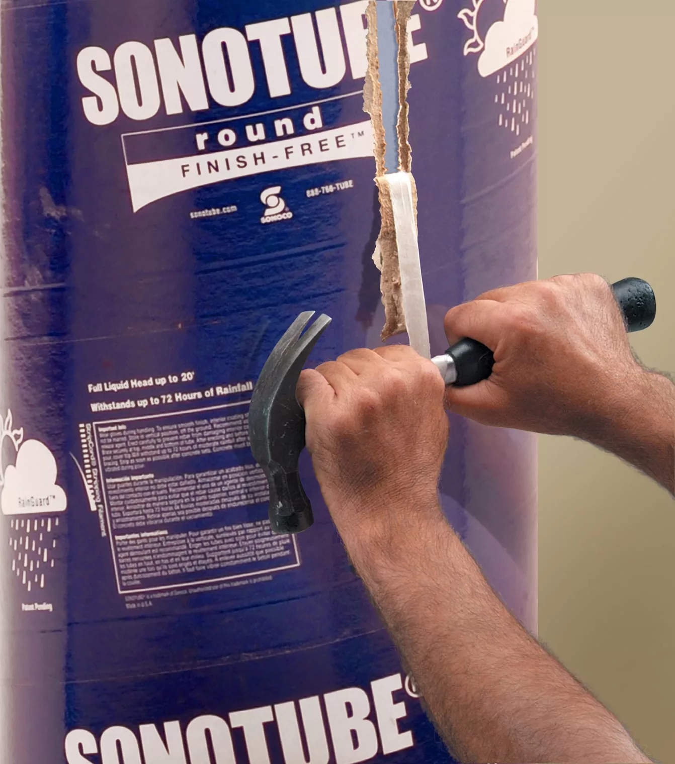 Hands using a hammer to pull the Stripcord stripping filament through a Finish Free form wall