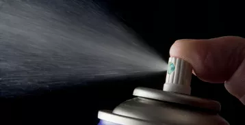 Image of aerosol cleaner being sprayed