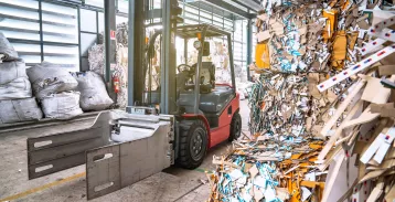 Forklift with bales of recyclable goods