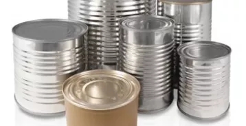 Metal cans of varied sizes and heights with no labels grouped together