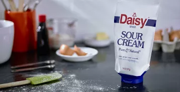 Daisy sour cream pouch on kitchen counter - inverted laminate flexible pouch with fitment