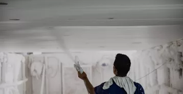 Man spraying coating
