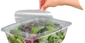 Salad packaging with plastic film.