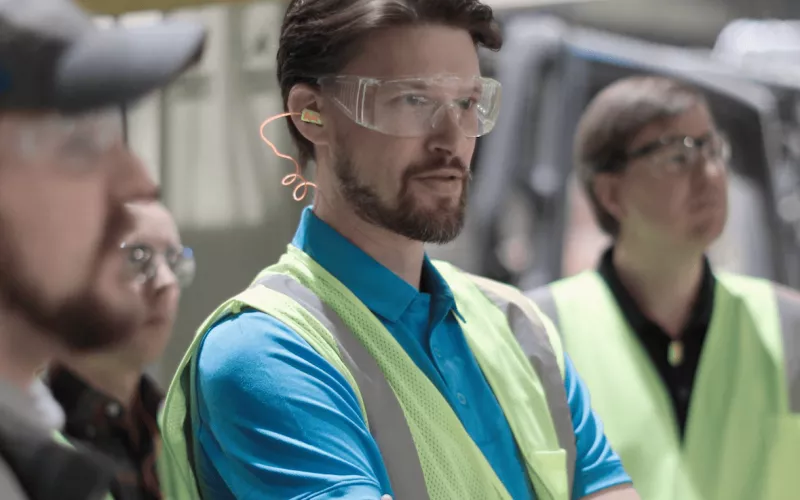 Scott Byrne with partners in a recycling facility.