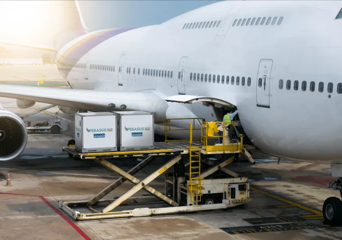 Temperature Assurance boxes being loaded into a plane's cargo hold
