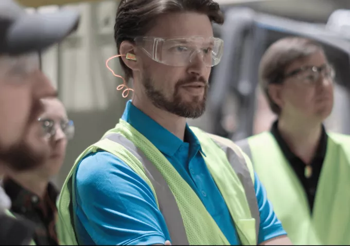 Scott Byrne with partners in a recycling facility.